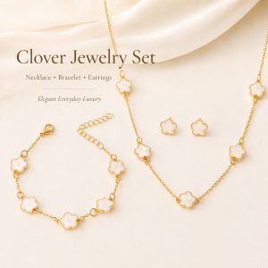 clover jewelry set with gold chain, including necklace, bracelet and earrings in a soft luxury style