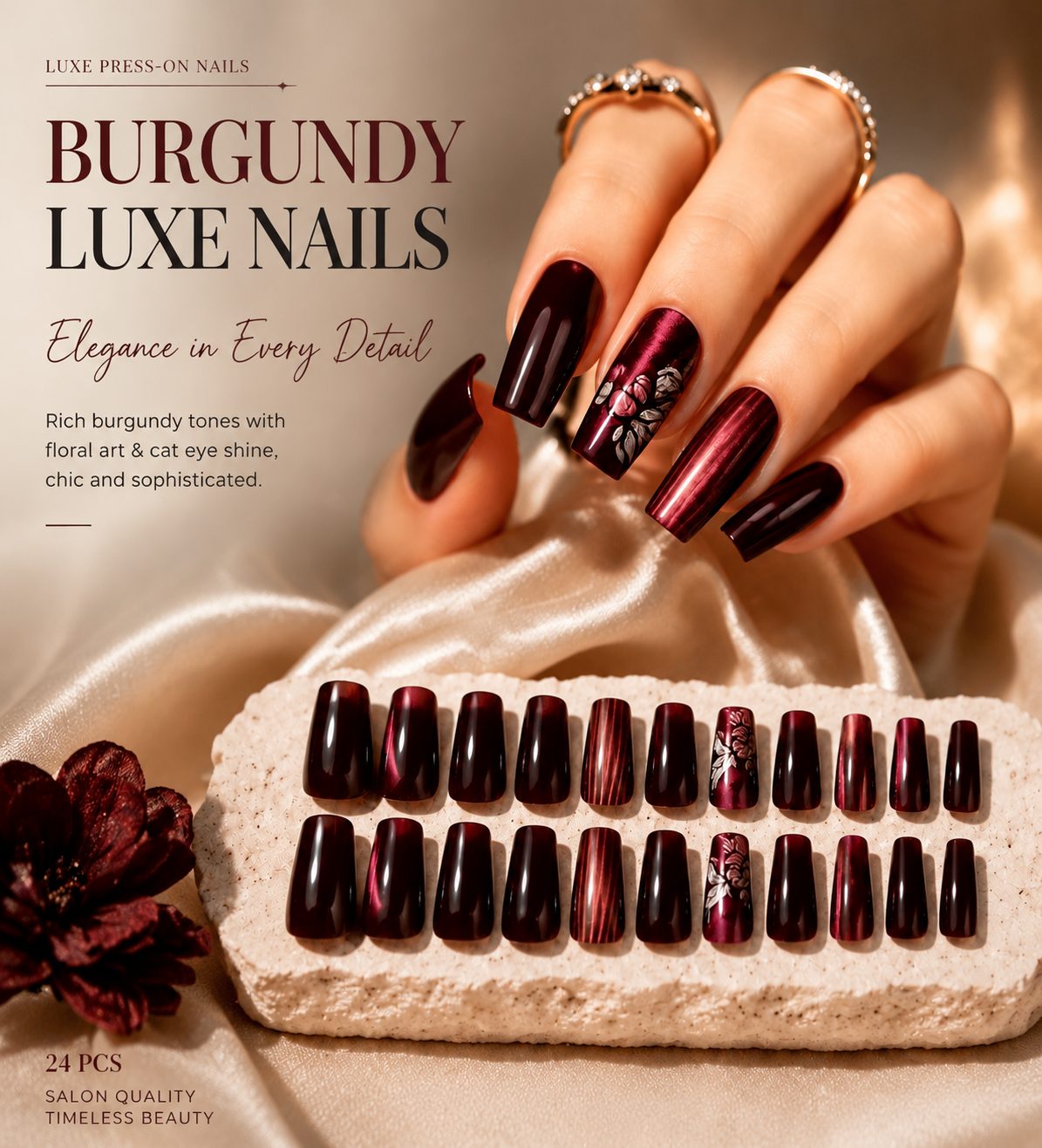 Burgundy press-on nails with glossy cat-eye shimmer, floral accent design, and elegant salon-style finish for a luxury manicure look.