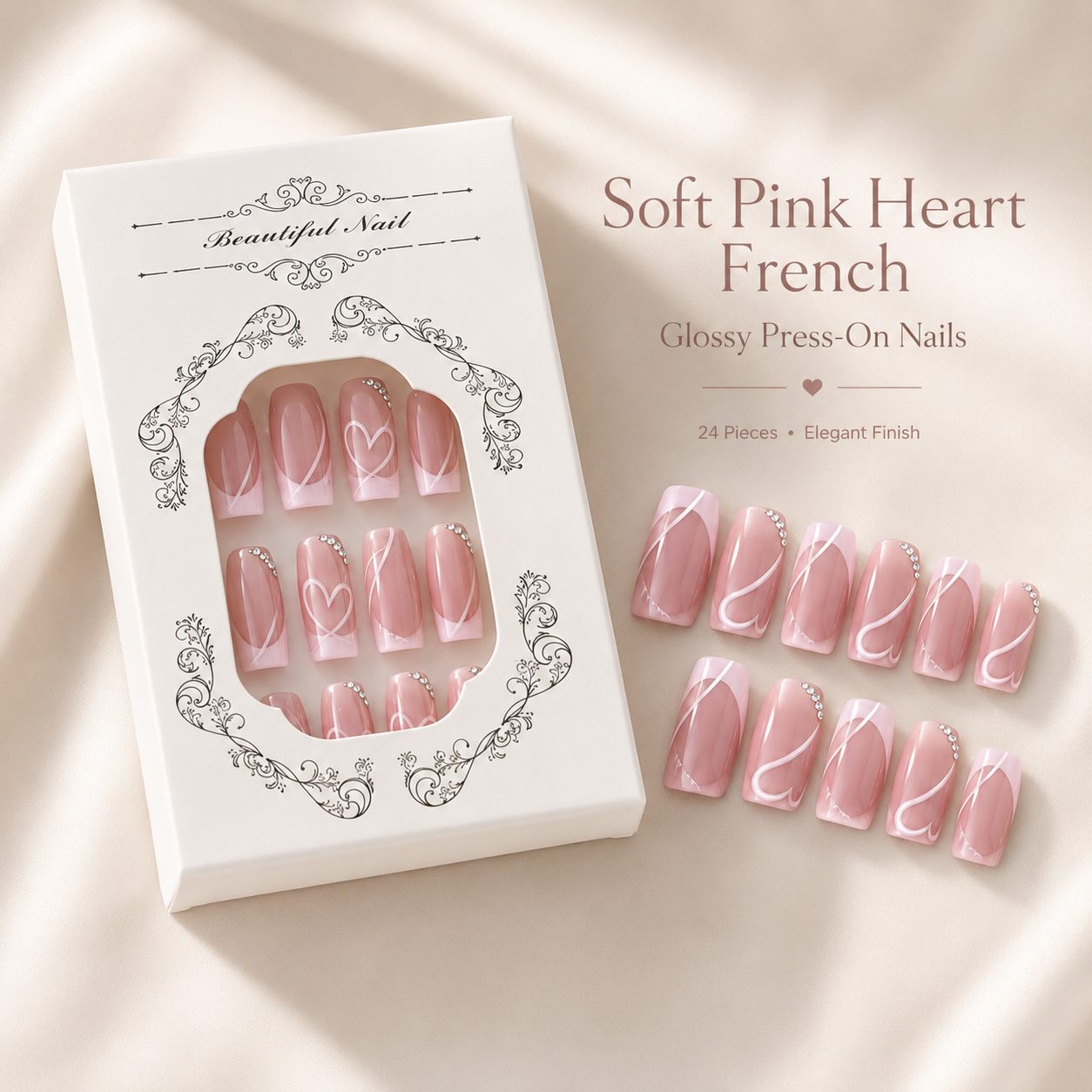 Soft pink heart French press-on nails displayed with luxury white packaging box on a cream background