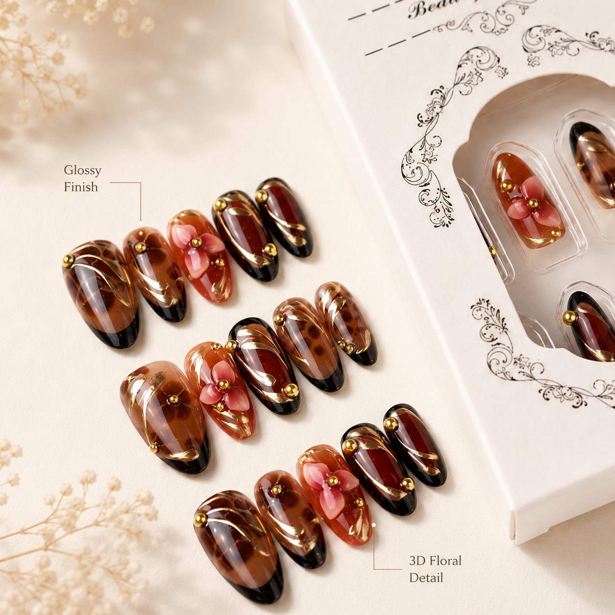 Close-up detail of brown floral press-on nails featuring glossy finish, 3D flower accents, gold bead details, and luxury nail art design