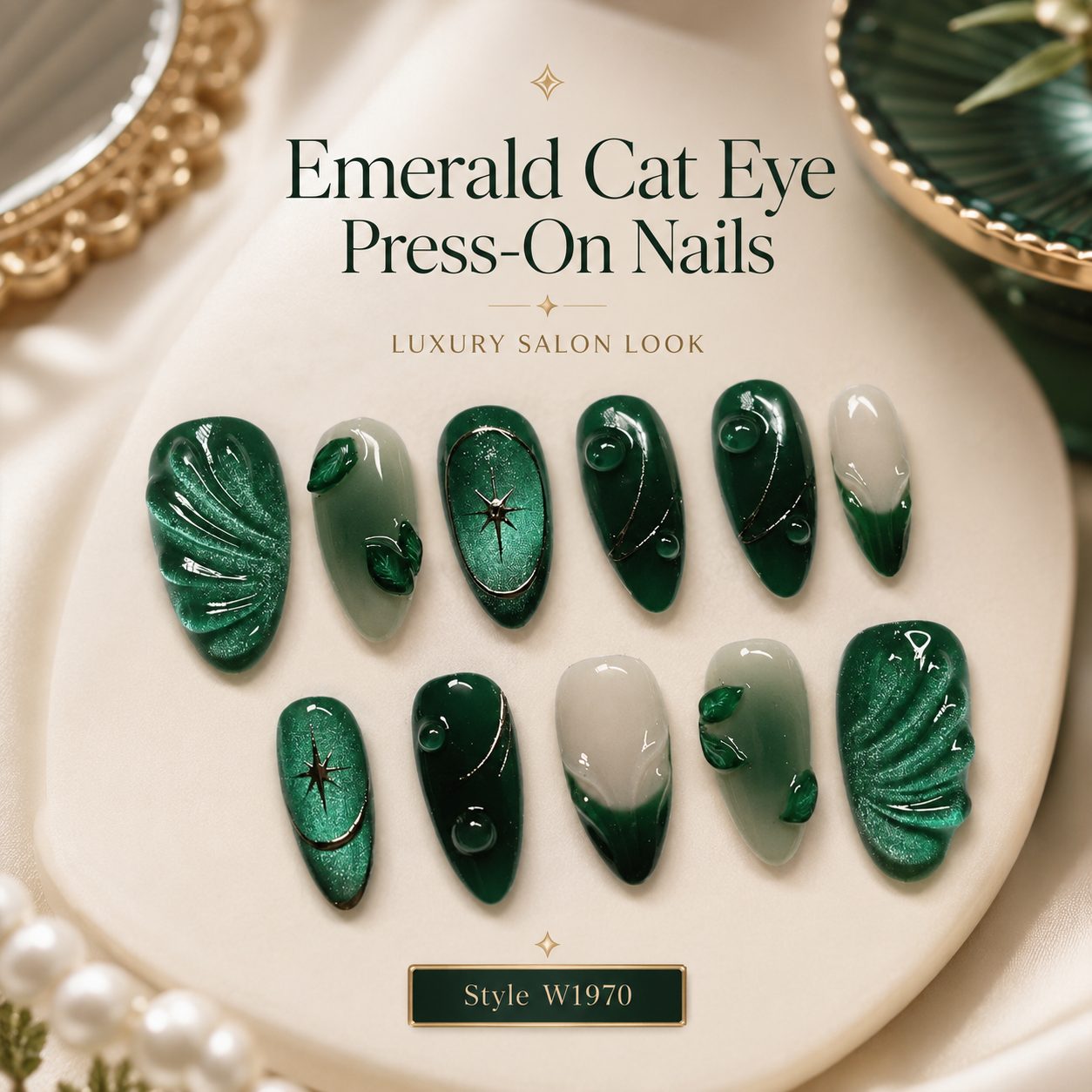 Emerald green cat eye press on nails 24 pcs set with glossy finish, 3D leaf design, gold accents and luxury salon look on beige satin background.
