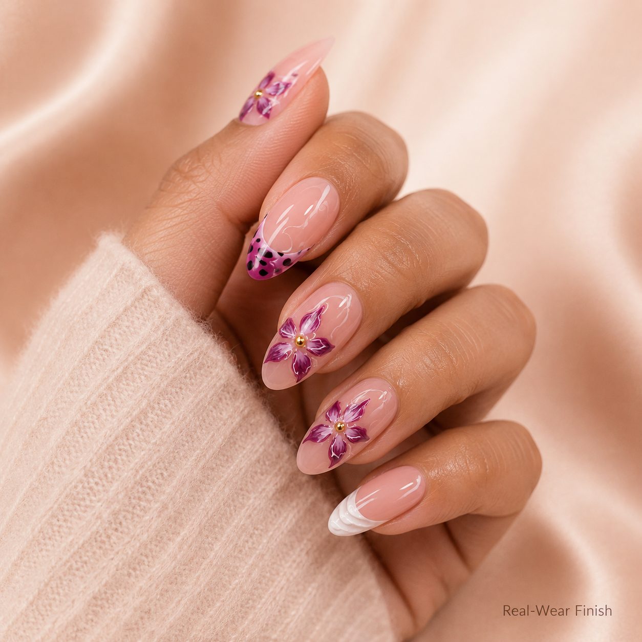 pink floral press on nails on medium skin hand